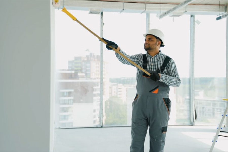 indian-painter-painting-a-wall-in-office-2024-07-22-20-40-28-utc